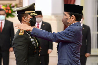 Indonesian President Joko Widodo, right, inaugurates the new Armed Forces Chief General Andika Perkasa, in November. He will be watching China’s military moves in the South China Sea closely.