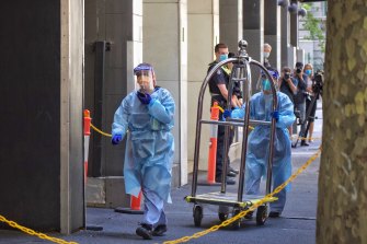 Staff in protective gear at the Holiday Inn in Flinders Lane on Tuesday.