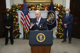 US President Joe Biden speaks as Vice-President Kamala Harris and director of the National Institute of Allergy and Infectious Diseases Dr Anthony Fauci look on. 