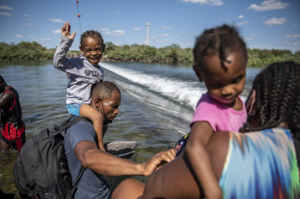 Migrants cross the Rio Grande in Ciudad Acuna, Mexico, on Thursday.