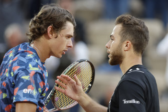 Australia’s Alex de Minaur (left) and France’s Hugo Gaston face off after their first round match of the French Open tennis tournament at Roland Garros on Tuesday.