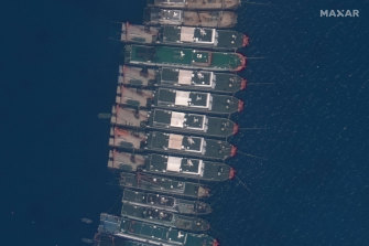 A satellite image shows Chinese vessels anchored at Whitsun Reef, near six Manila-claimed islands in the disputed South China Sea, in March. 