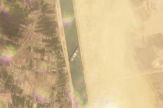 A satellite image from Planet Labs shows cargo ship MV Ever Given stuck in the Suez Canal.