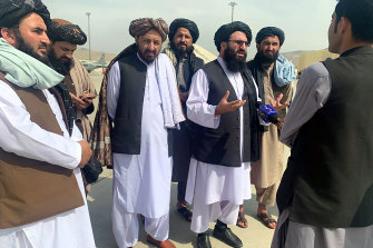 Taliban officials gave a press conference on the tarmac. 