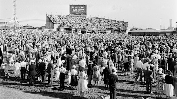 A crowd of 65,000 people attend the evangelist Billy Graham’s crusade at the Sydney Showground in 1959.