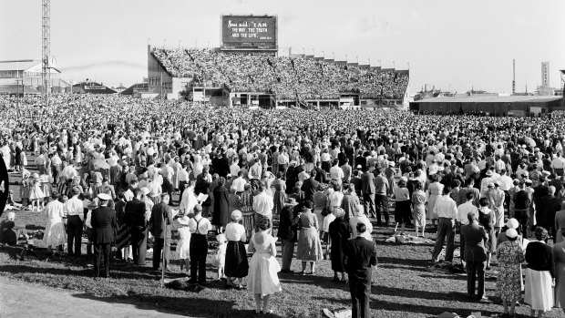 A crowd of 65,000 people attend the evangelist Billy Graham’s crusade at the Sydney Showground in 1959.