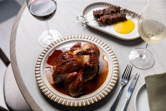 Half free-range chicken with white corn puree and ox tongue anticuchos (top right). 