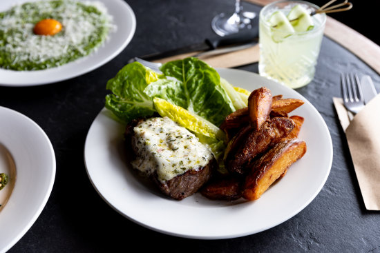 Striploin with chimichurri butter, twice-cooked chips and cos lettuce.