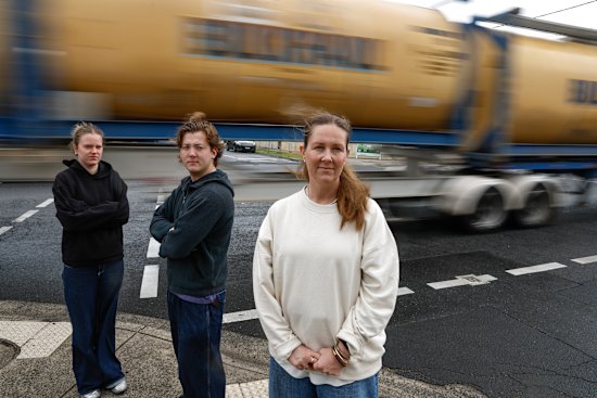 Mother-of-three Felicity Forrester, pictured with Maia and Rex, has lived at the corner of Williamstown Road for two decades, and she is angry that the road has not been given truck curfews.