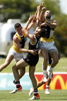Max King, centre, attempts to mark the ball during St Kilda's intra-club match. 