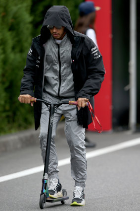 Hamilton scoots around the F1 Paddock in Japan earlier this month.