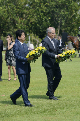 Mr Morrison at a wreath-laying ceremony with Japanese Prime Minister Shinzo Abe in Darwin on Friday afternoon ahead of APEC.