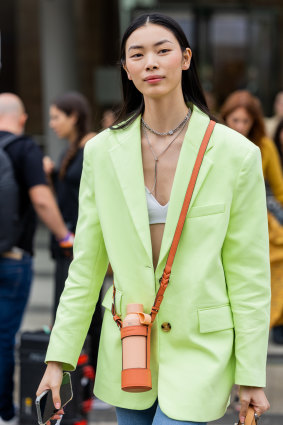 A model outside the Ulla Johnson show at New York Fashion Week with a reusable water bottle.