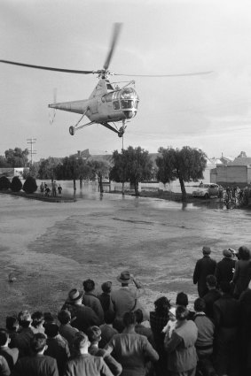 A helicopter laden with emergency supplies lands in Forbes on June 20, 1952.