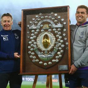 Storm coach Craig Bellamy and Dale Finucane of the Storm pose with the JJ Giltinan Shield.