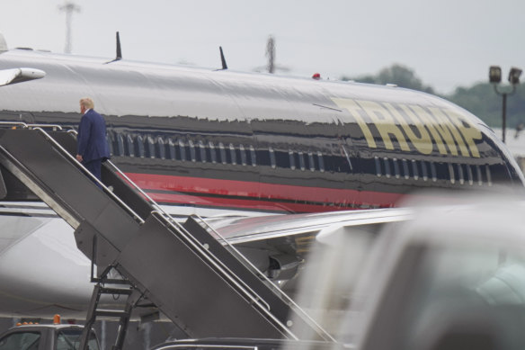 Former President Donald Trump boards his plane at Newark Liberty International Airport in New Jersey.