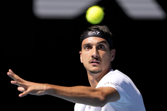 Lorenzo Sonego of Italy plays a forehand return to Ben Shelton of the U.S. during their quarterfinal match.