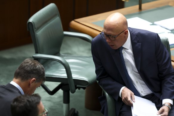 Peter Dutton in conversation on the floor of the House of Representatives this week.