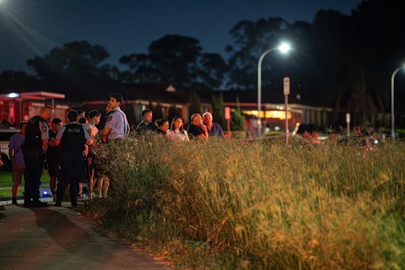 Police shield the public from the incident.