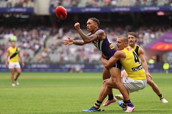 Shai Bolton gets a handball away under pressure during the team’s win over Richmond in round three.