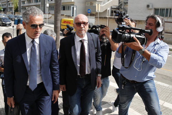 Canadian-born film director Paul Haggis, centre, arrives with his lawyer at Brindisi law court in southern Italy in June after he was arrested and accused of sexual assault which he denied.