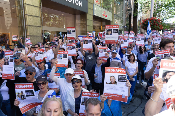 Attendees at the “United with Israel” rally in Martin Place held placards bearing the names and pictures of Israelis kidnapped by Hamas.