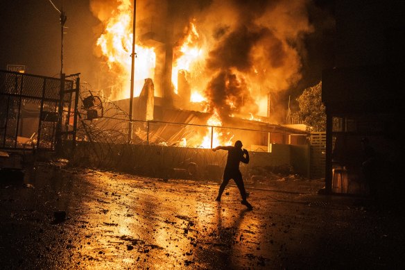 Demonstrators set a building belonging to the Lebanese security forces, located at the entrance of the US embassy in Beirut, on fire. 