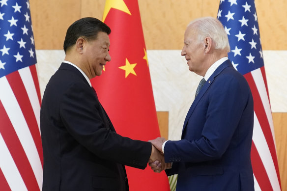 US President Joe Biden and Chinese President Xi Jinping shake hands before their meeting on the sidelines of the G20 summit on Monday.