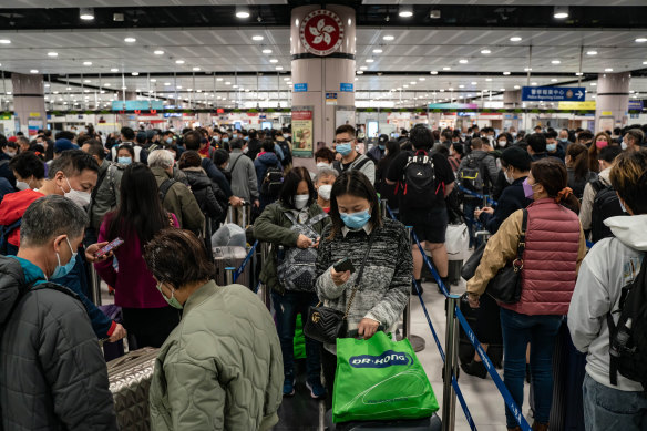 Travellers wait to cross Hong Kong’s Lok Ma Chau border checkpoint on Sunday.