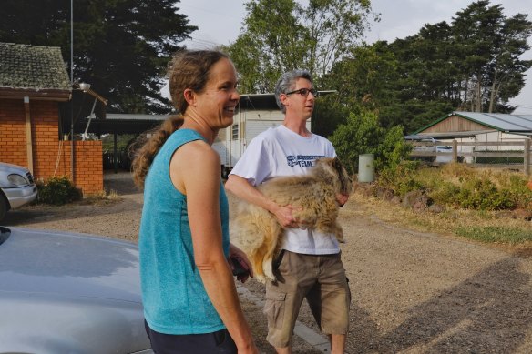 Plenty residents Ben, Lydia and their dog Eli prepare to evacuate their Mackelroy Road home ahead of a wind change.