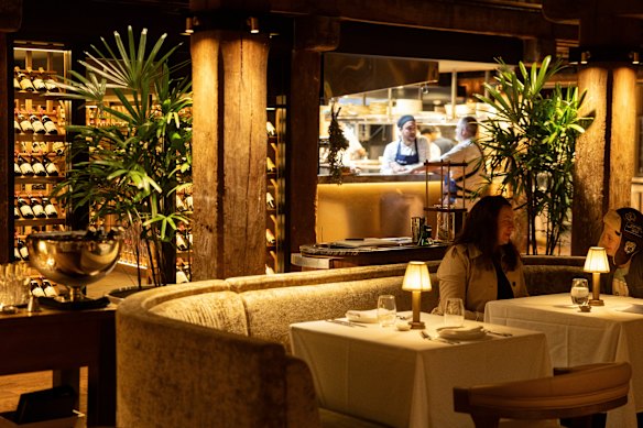 Comfortable booths and spotlit tables are spaced among heritage pylons.    