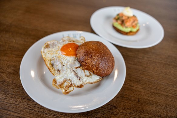 The breakfast bun with sausage, fried egg, cheese and hash brown with NZ King Ora salmon confit. 