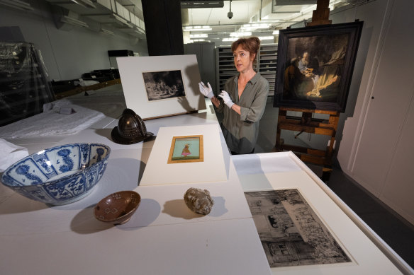 Curator Petra Kayser pictured with objects from the upcoming Rembrandt exhibtion at NGV, which will include a recreation of the artist’s “cabinet of curiosities”.
