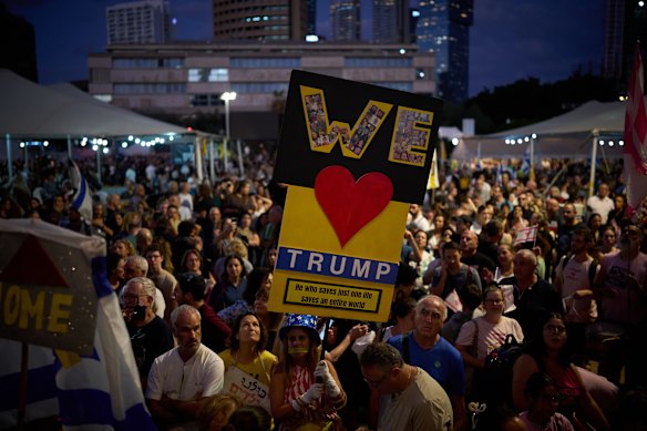 People in Tel Aviv celebrating the announcement that Israel and Hamas have agreed to the first phase of a peace plan to pause the fighting.