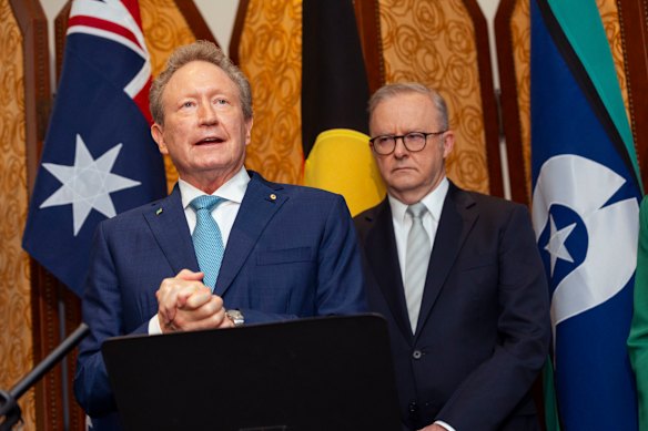 Prime Minister Anthony Albanese listens to Fortescue founder Andrew Forrest at a press conference in Shanghai on Monday.