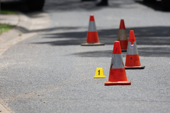 Police placed witches hats and crime scene markers on the road on Monday.