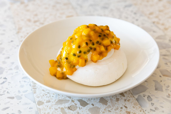Pavlova with diced mango and passionfruit puree at Bobbys.