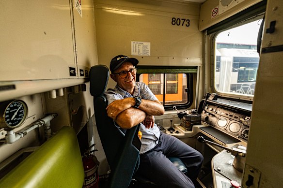 Long-serving train driver Peter Gunczy in the driver’s seat of a V-set passenger train.