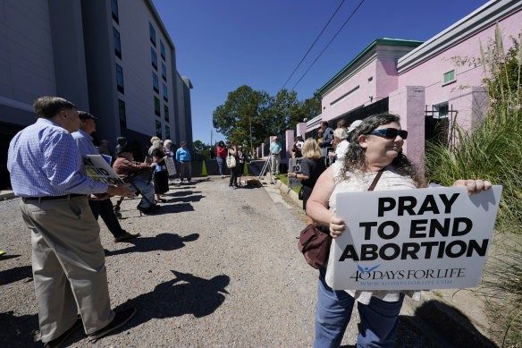 Anti-abortion protesters gather outside the Jackson Women’s Health Organisation clinic in Jackson, Mississippi, the state’s only facility able to provide abortions on demand.