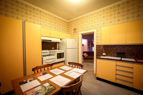 The bright yellow, orange and brown period kitchen was a key feature of the original home.