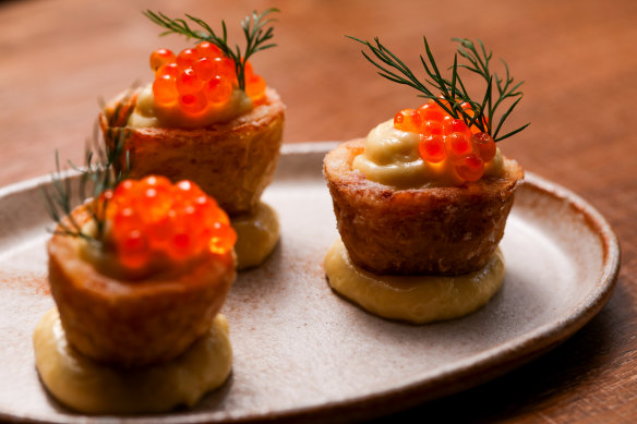 Potato skins with taramasalata and salmon caviar. 