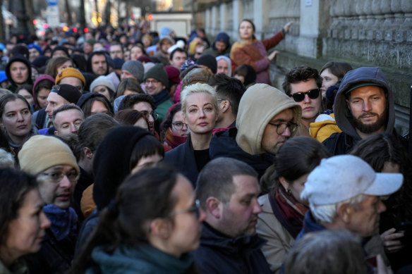 Yulia Navalnaya, center, widow of Alexey Navalny, stands in a queue with other voters at a polling station near the Russian embassy in Berlin.