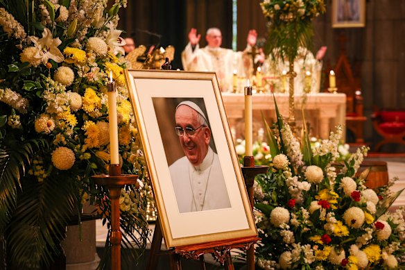 The Pope’s portrait at the foot of the altar.