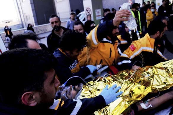 Rescue workers pull out Samir Muhammed Accar from a collapsed building in Antakya, Turkey.