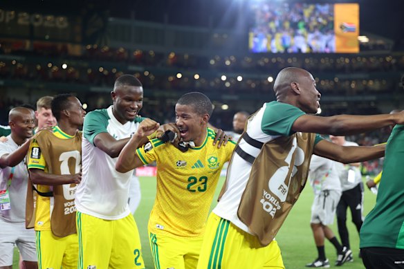 South African players dance after their win.