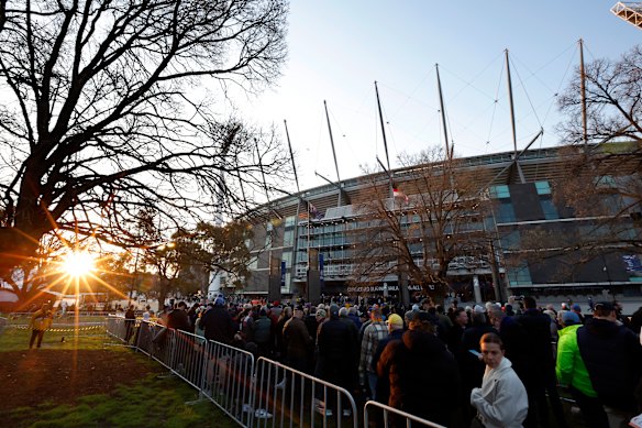 Football fans line up outside the members gates before the AFL Grand Final match between Sydney Swans and Brisbane Lions at Melbourne Cricket Ground, on September 28, 2024, in Melbourne.