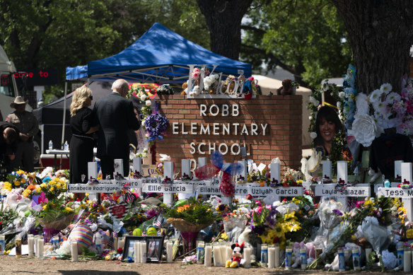 President Joe Biden and first lady Jill Biden visiting a memorial at Robb Elementary School in Uvalde on Sunday.