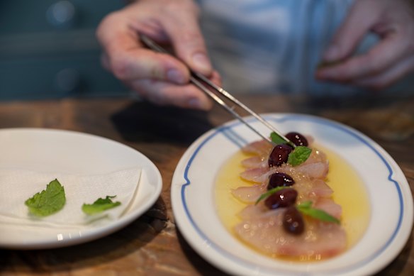Kingfish with preserved lemon and Taggiasca olives from the crudo bar.   