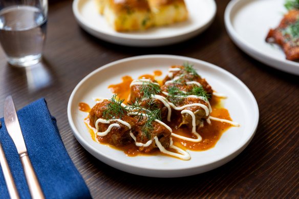 Porcini-stuffed cabbage rolls in roasted tomato sauce.