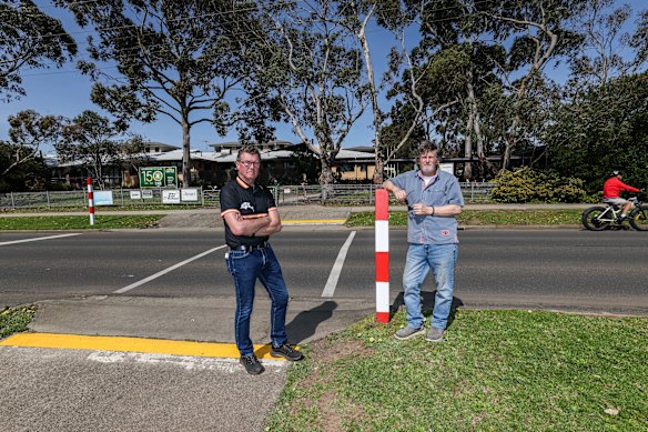 McDonald’s opponents Geoff Moed and Trevor Ware in front of the school where the proposed outlet will be built. 